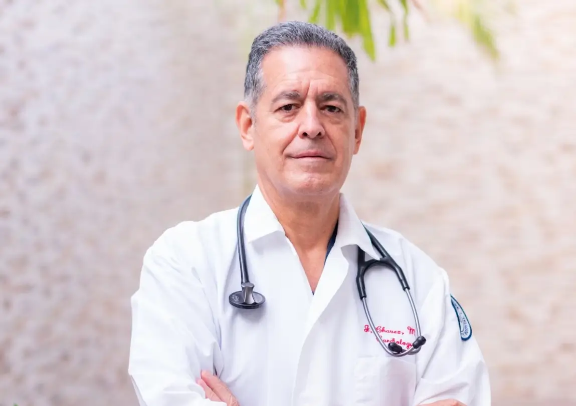 Dr. Jonathan Mercer, board-certified ophthalmologist, portrait in white coat